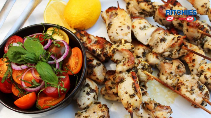 Chicken lemon and oregano kebabs with tomato salad